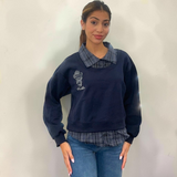 Navy sweatshirt with a check shirt collar and matching check hem, worn with blue jeans