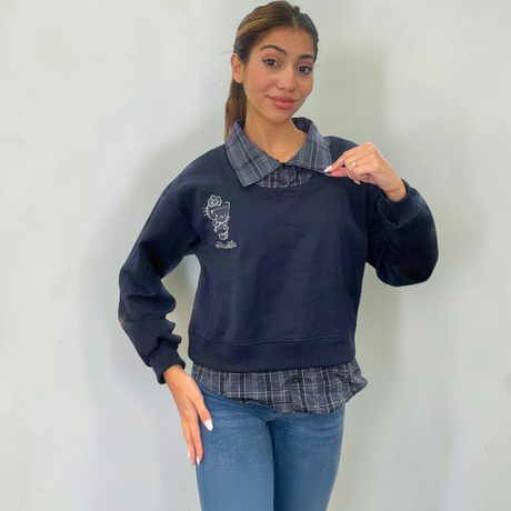 Navy sweatshirt showing the open check collar and dropped shoulder sleeves