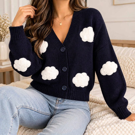 Navy V neck knit cardigan with fluffy white cloud patches and button front, worn with jeans