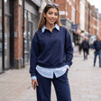 Navy lounge set styled with sunglasses pushed up and one hand in the pocket