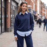 Navy lounge set styled with sunglasses pushed up and one hand in the pocket