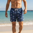 Men's navy shark print swim shorts on the beach, Jack Gifts Online Lebanon