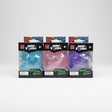 Three boxed NeeDoh Jelly Squish jellyfish toys in blue, pink and purple with clear window packaging