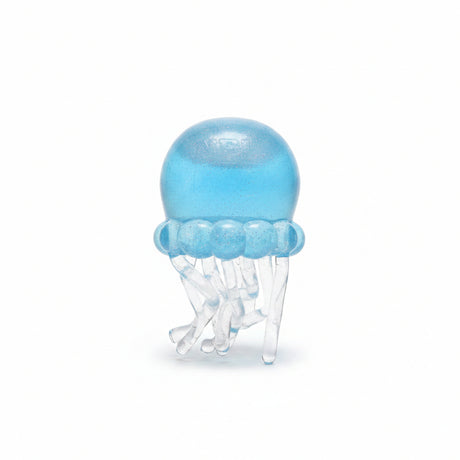 Blue glitter jellyfish squish toy with clear tentacles standing unboxed on a white background