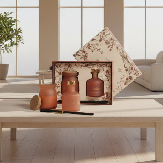 Terracotta and salmon frosted bottles with a cream floral printed lid across the box