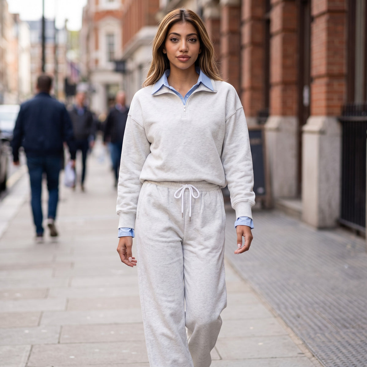 Light grey marl quarter zip sweatshirt worn with matching drawstring joggers