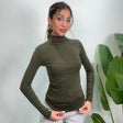 Olive green fitted turtleneck pulled down at the hem, smooth stretch knit