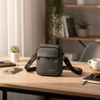 Olive mini bag on a wooden table with a blurred background