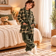 Boy in an olive plaid fleece robe with a tie belt, matching top and olive trousers