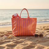 Orange and pink striped coated beach tote bag with rolled handles