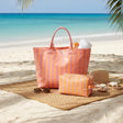 Orange striped beach tote and matching pouch set on the sand – Jack Gifts Online Lebanon
