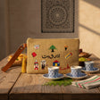 Jute pouch cross stitched with Beirut icons, a tarbouche, coffee cup and costumed figures