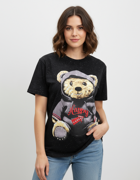 Woman wearing a black tshirt with a teddy bear graphic design on a plain background