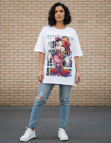 Person wearing a white graphic tshirt of Mickey Mouse and ripped jeans standing against a brick wall