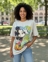 Person wearing a tshirt with a colorful graphic design of Mickey Mouse in an outdoor setting