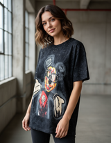 Woman wearing a black tshirt with colorful graphic design of Mickey Mouse in an indoor setting
