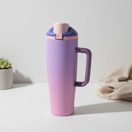 Lavender to pink ombre insulated tumbler with a flip lid and loop handle