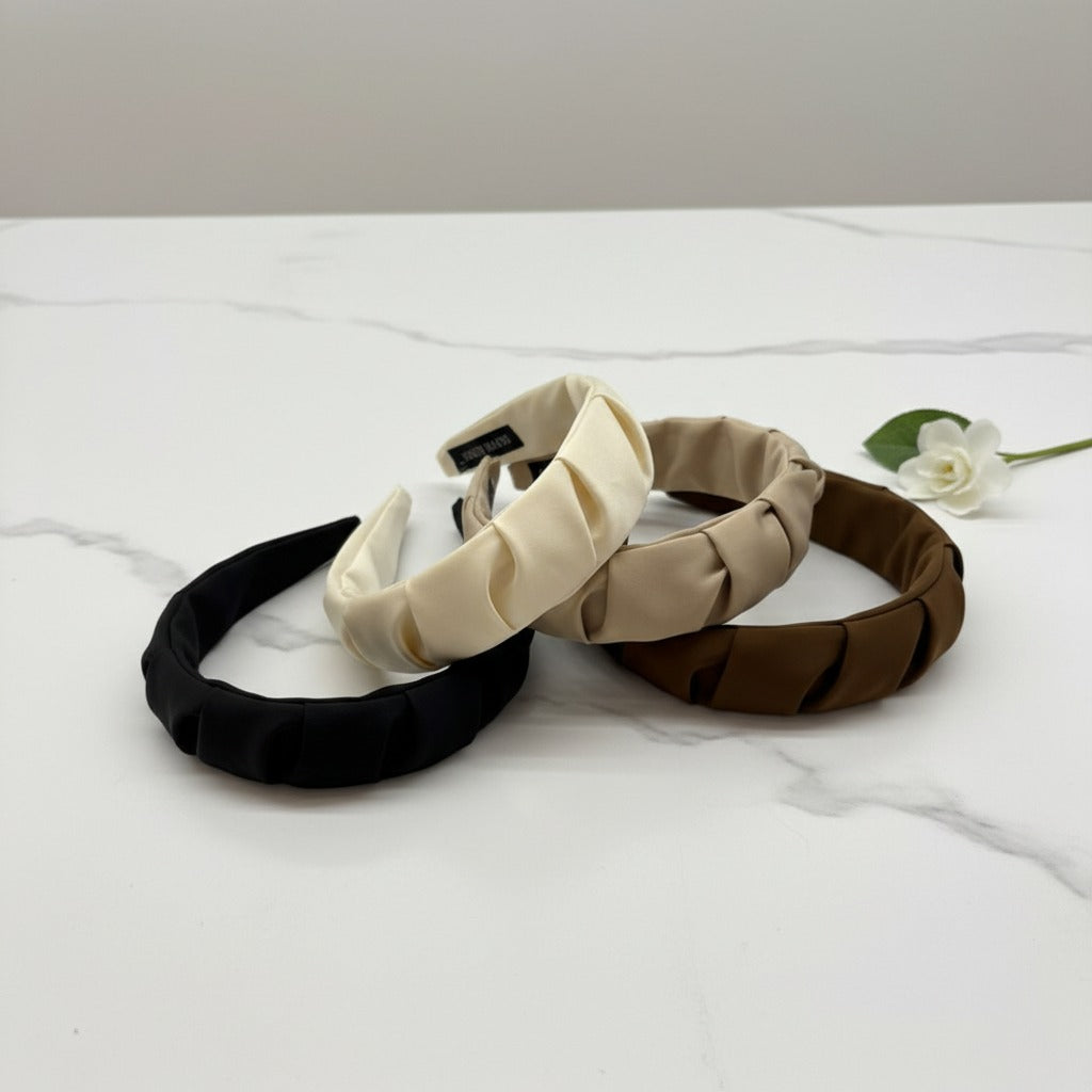 Padded headbands in black, white, beige and brown