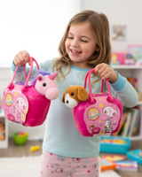 Girl holding up two pink pet carry cases by their rope handles in a bedroom