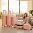 Blush pink hard shell luggage set of four with a vanity case