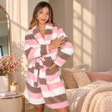 Pink, cream and cocoa striped fleece robe worn belted, hand resting on the chest