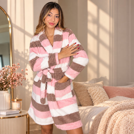 Pink, cream and cocoa striped fleece robe worn belted, hand resting on the chest