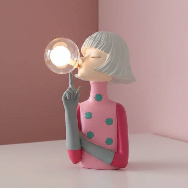 Soft pink dress with teal spots, silver bob and one finger raised beside a lit globe