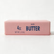 Pink butter stick squishy printed with Salted Butter and 4 oz in blue