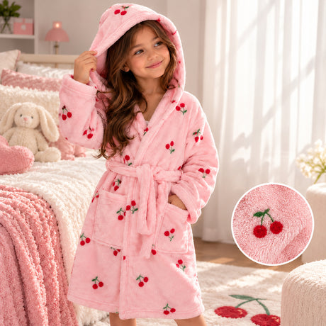 Girl in a pink fleece robe with red cherry embroidery, hood up, with a cherry close up inset