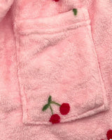 Front patch pocket and cherry embroidery detail on the pink fleece robe