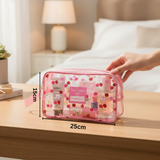 Pink cherry pouch with cosmetic items on a wooden surface, and measurements displayed 15x25cm