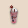 Dusty rose glitter tumbler with a red dinosaur straw topper and a Mom print