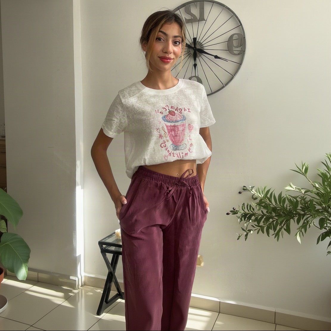 Pink drink print crop tee styled with burgundy drawstring trousers