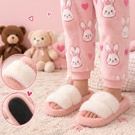 Girl wearing pink fluffy slide slippers with a cream faux fur strap, with close ups of the strap and black grip sole