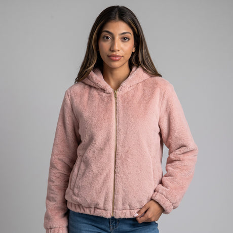 Pink faux fur zip jacket with a teddy texture, worn with jeans