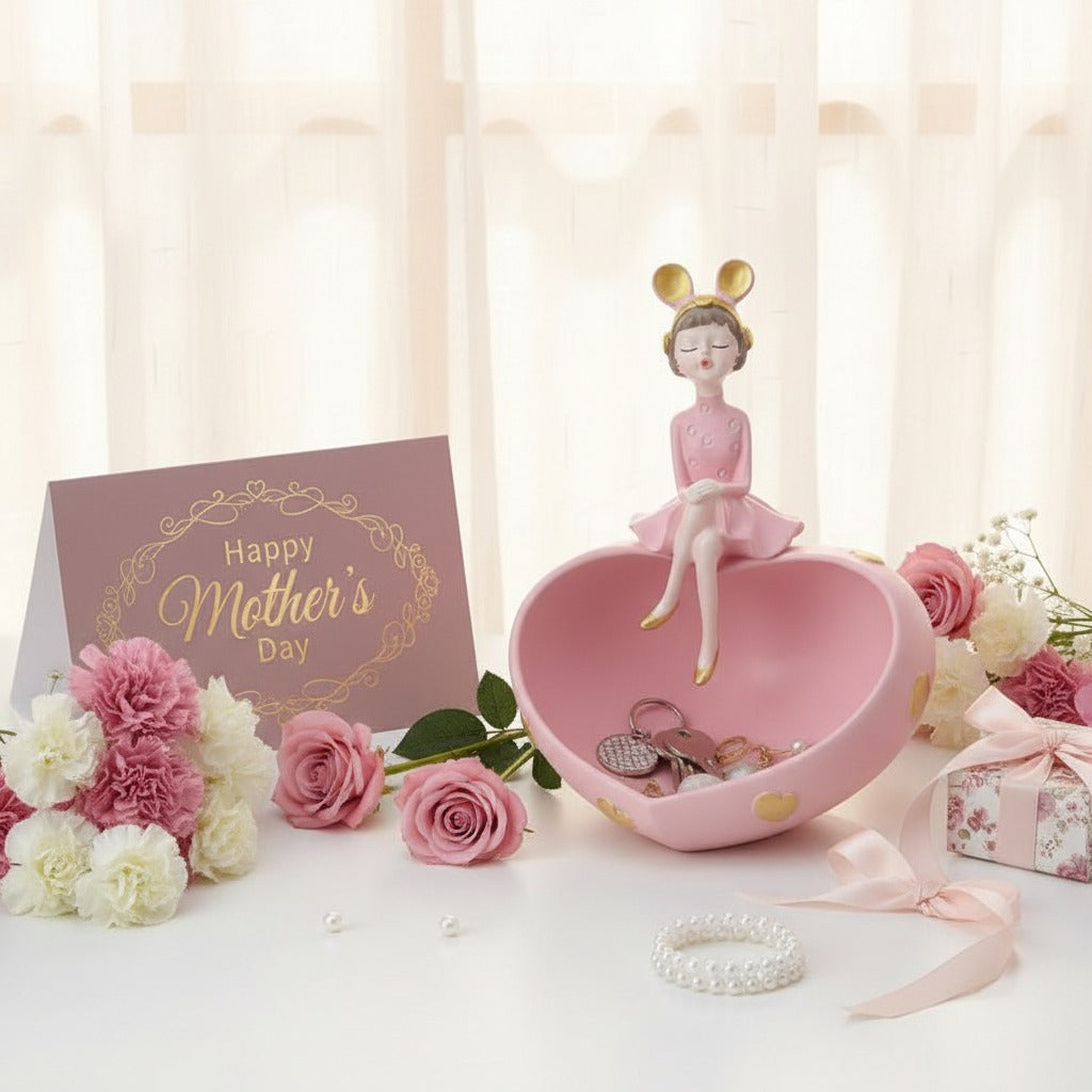 Pink heart dish among carnations and a ribboned gift box in sunlight through a curtain