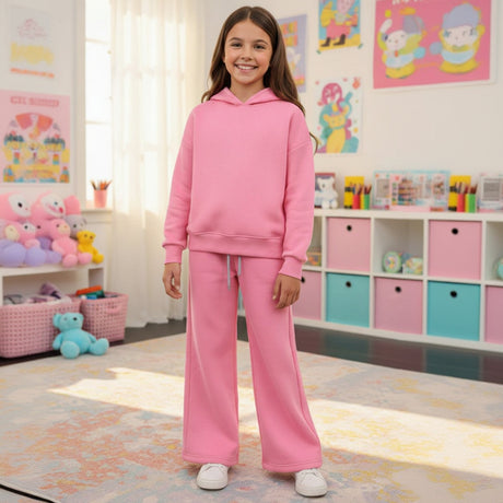 Girl in a pink fleece hoodie and matching wide leg joggers