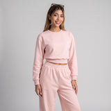 Pink cropped sweatshirt and joggers seen straight on