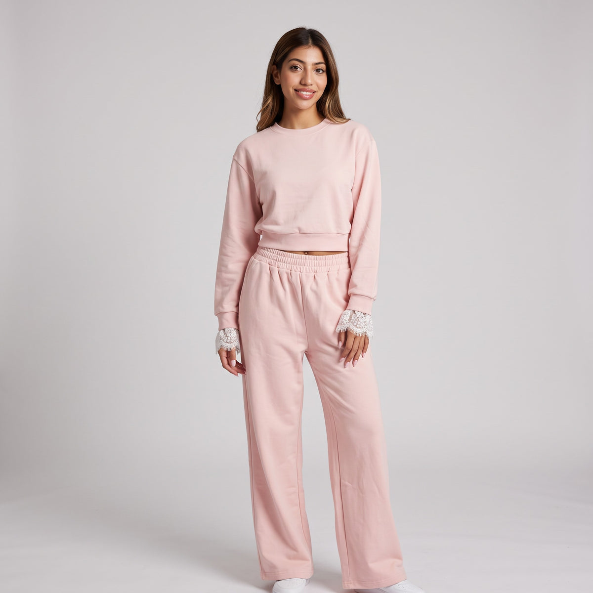Head to toe blush pink, joggers falling wide to the floor