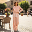 Woman in blush pink lace trim sweatshirt and wide leg pants set, Jack Gifts Online Lebanon