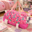 Pink leopard print duffle bag with a kitty face, plush ears and paws on a pastel heart rug