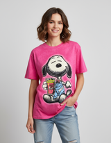 Person wearing a pink tshirt with a cartoon dog character design on a plain background