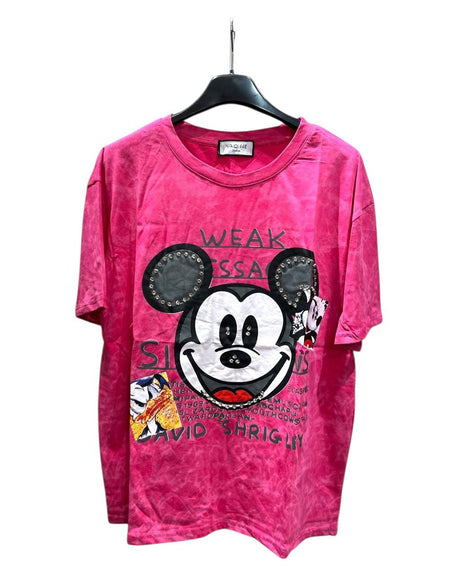 An oversized red tshirt with a graphic of Mickey Mouse and text on a hanger
