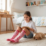 Girls pink knee high socks with a full body Pink Panther cartoon print and deep pink cuffs and toes