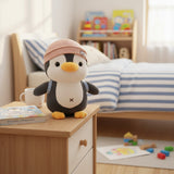 Pink beanie hat penguin plush on bedside table