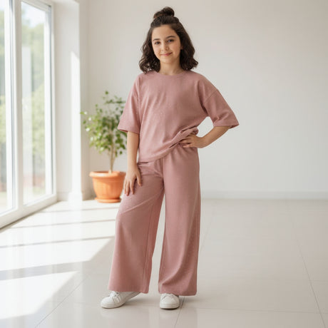 Girl in a dusty rose sparkle tee and matching wide leg pants
