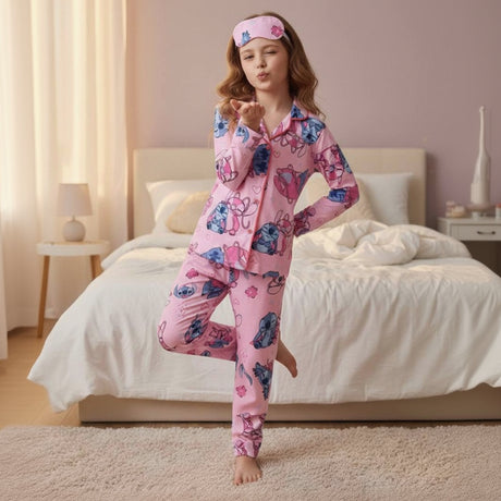 Woman wearing pink Lilo and Stitch pajamas and a matching headband in a bedroom