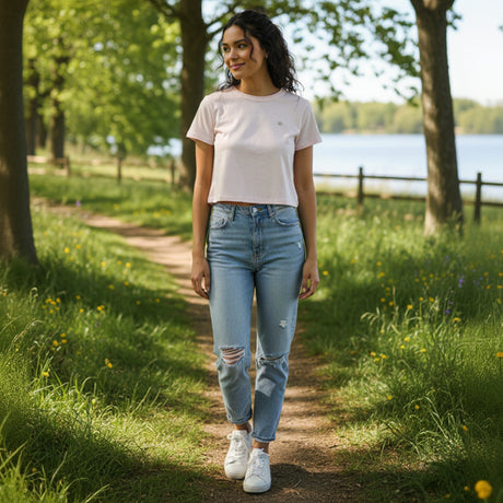 Woman wearing a pink crop top outside in nature
