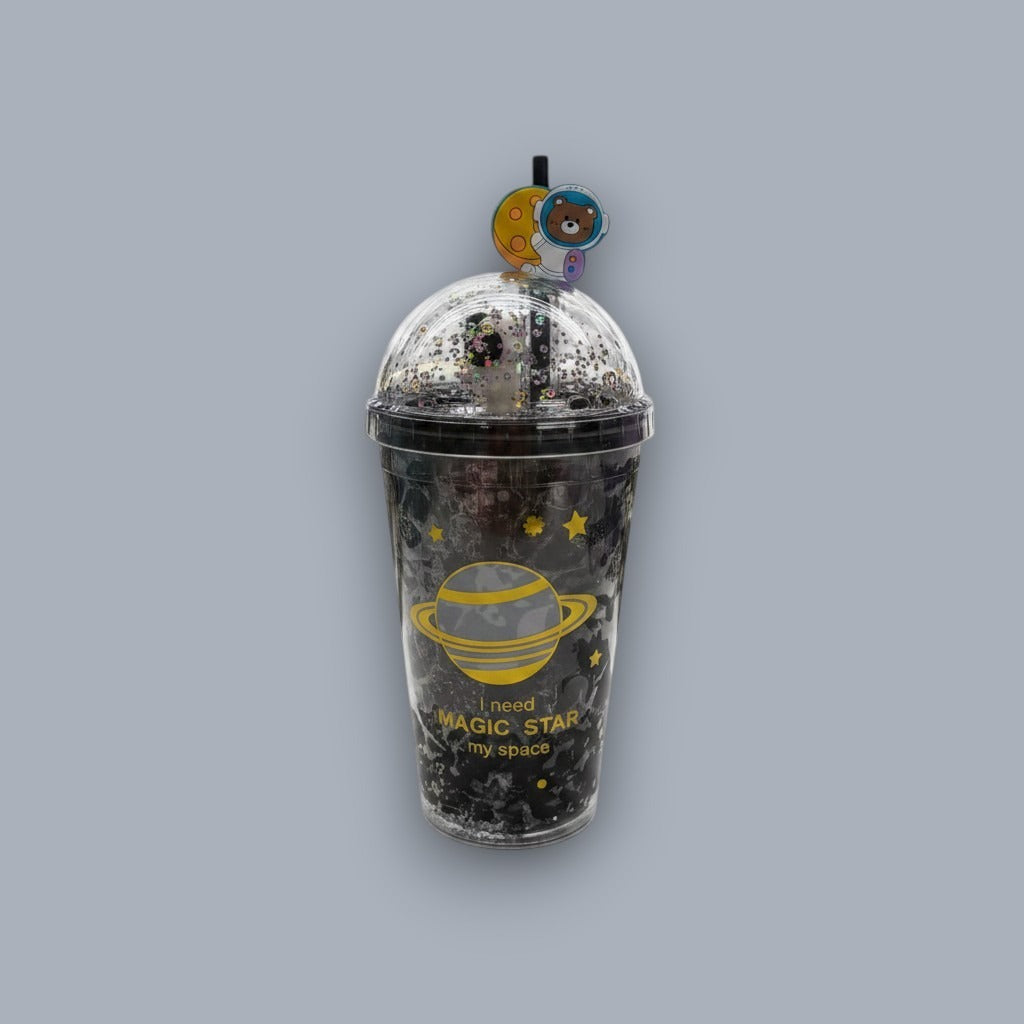 Black tumbler printed with a gold ringed Saturn and stars, with a glitter dome