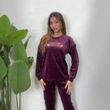 Plum velvet pajama top with gold Enjoy The Journey script, worn with matching pants